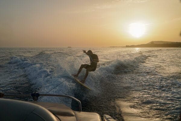 Wakesurfer riding a wave at sunset in Lanzarote
