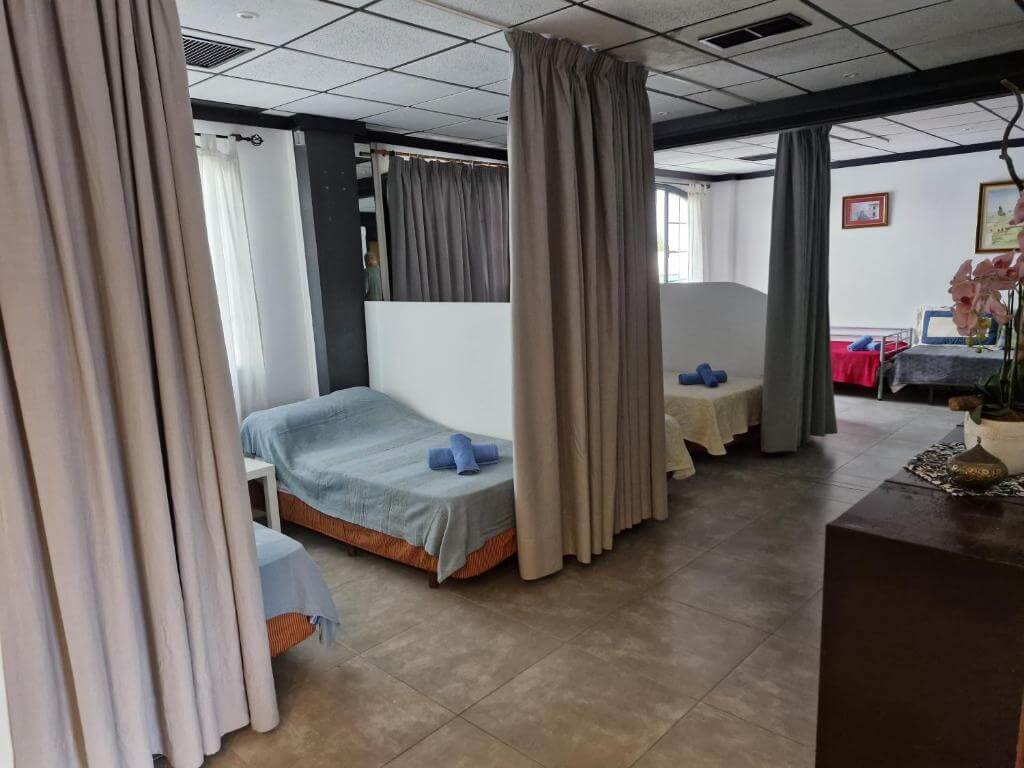 Shared hostel dorm with privacy curtains in Playa Blanca
